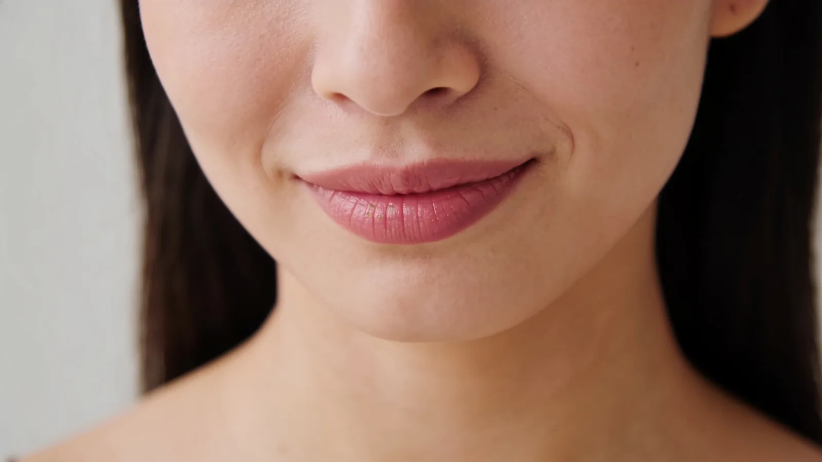 Close-up of natural lips with a gentle smile