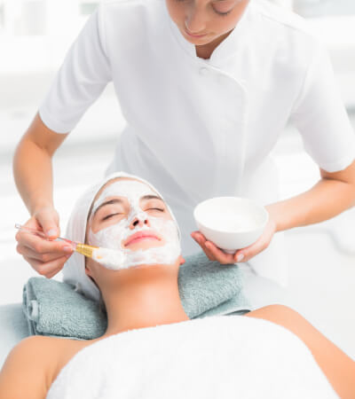 Attractive woman receiving treatment at spa center